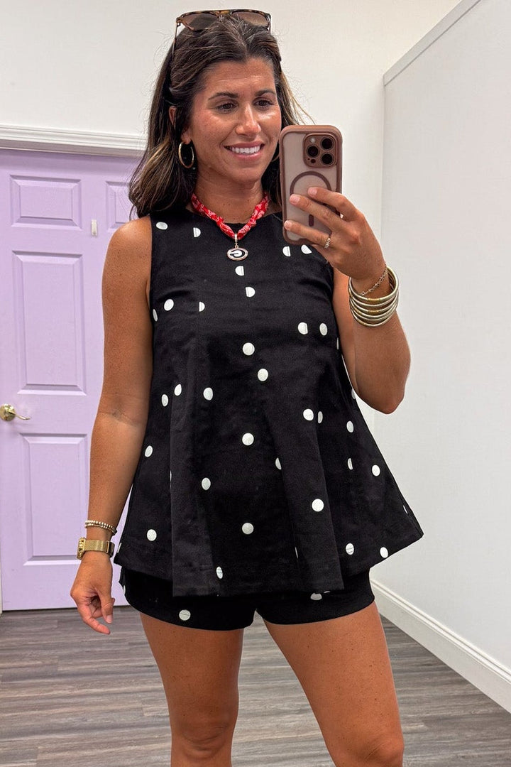 black with white polka dot print sleeveless crew neckline denim top