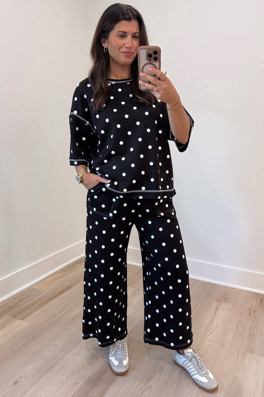 black with white polka dot print relaxed silhouette top and pants matching knit set with raw seam details