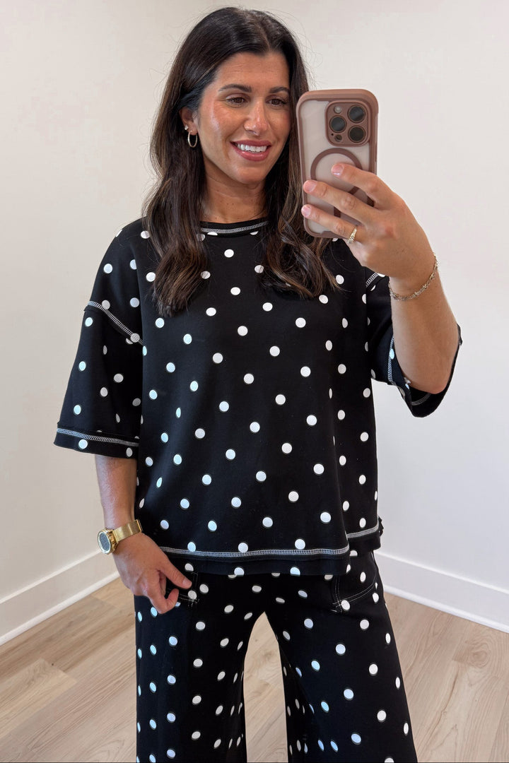 black with white polka dot print relaxed silhouette crew neckline top and pants matching knit set