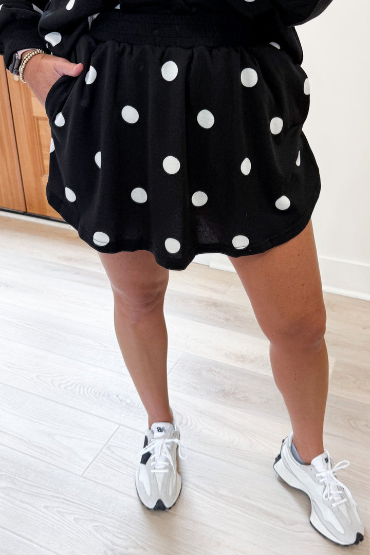 black with white polka dot print top and rounded hem skort matching terry cotton knit set