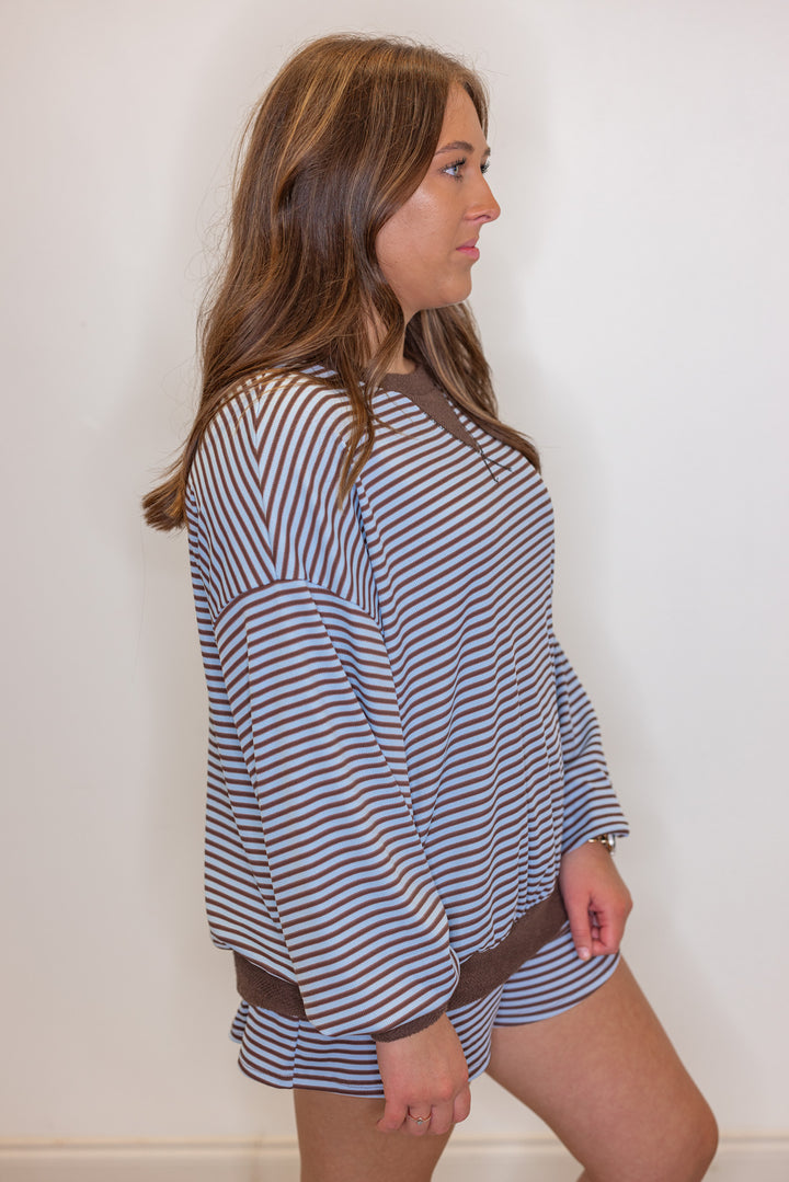 Womens light blue and brown striped knit top with contrasting terry knit trim by BucketList showing side view