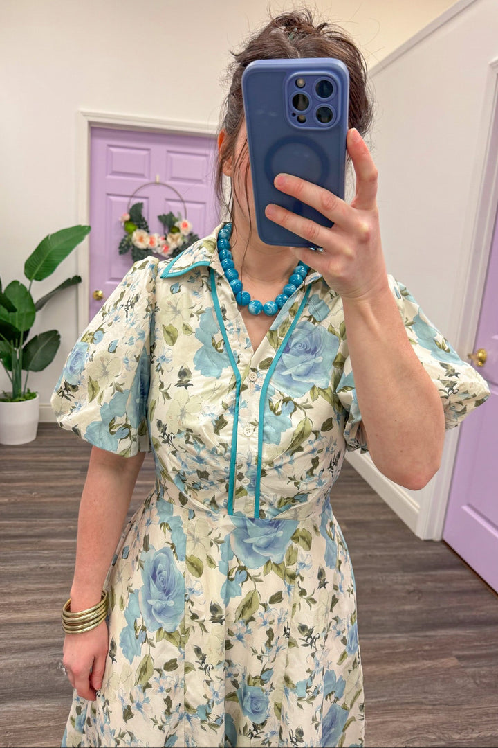 blue and cream floral print v neck button detail midi dress