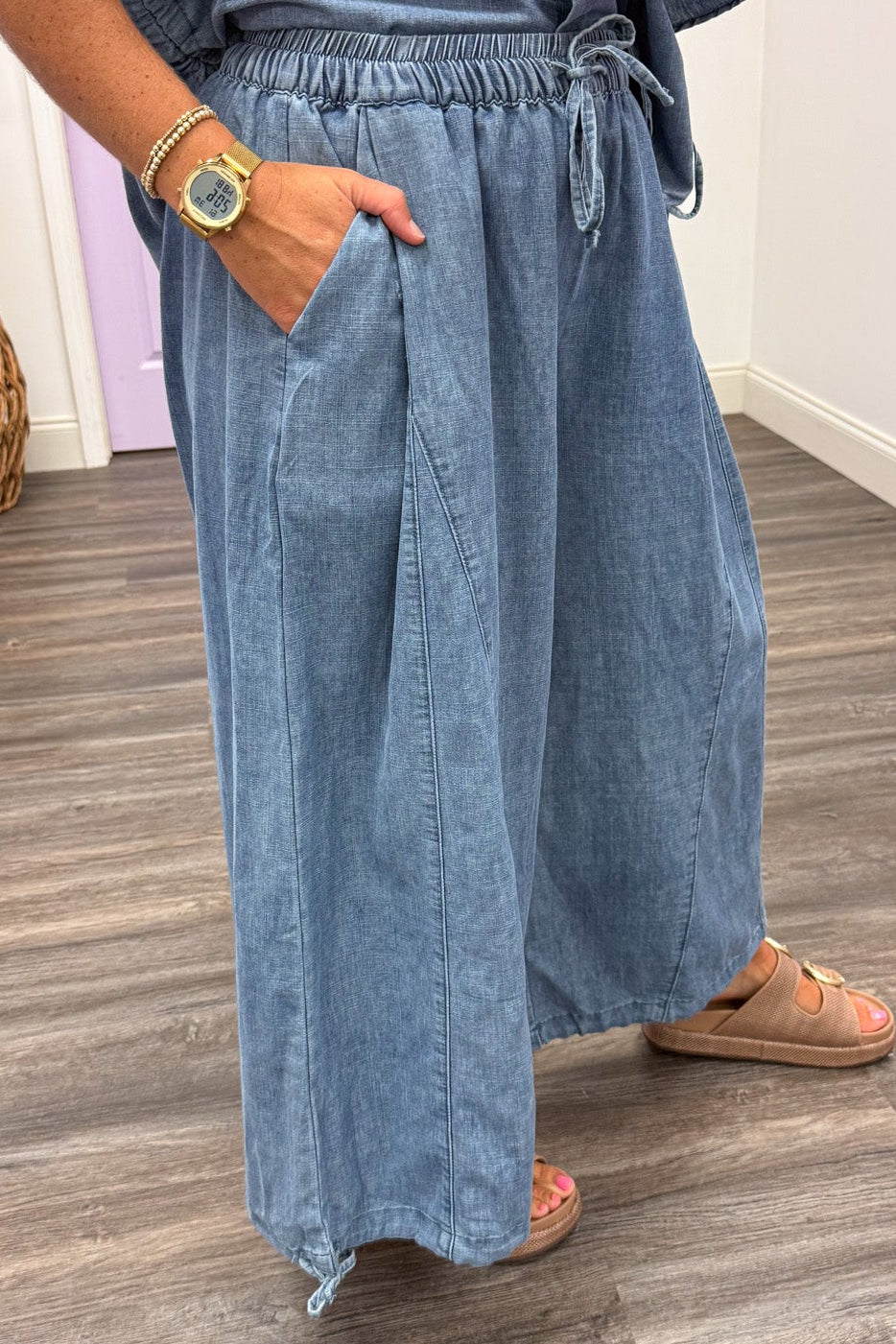 washed blue denim wide leg drawstring ankle jogger pants with front pockets
