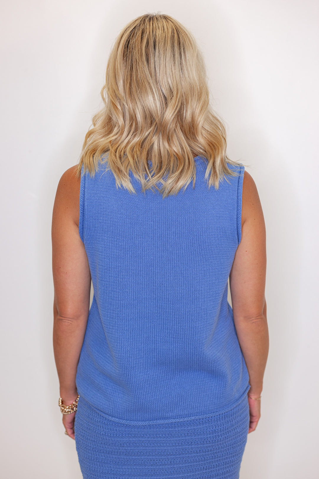 Women's blue sweater knit maxi skirt with matching sleeveless contrasting knit top by Wishlist showing up close back view of top