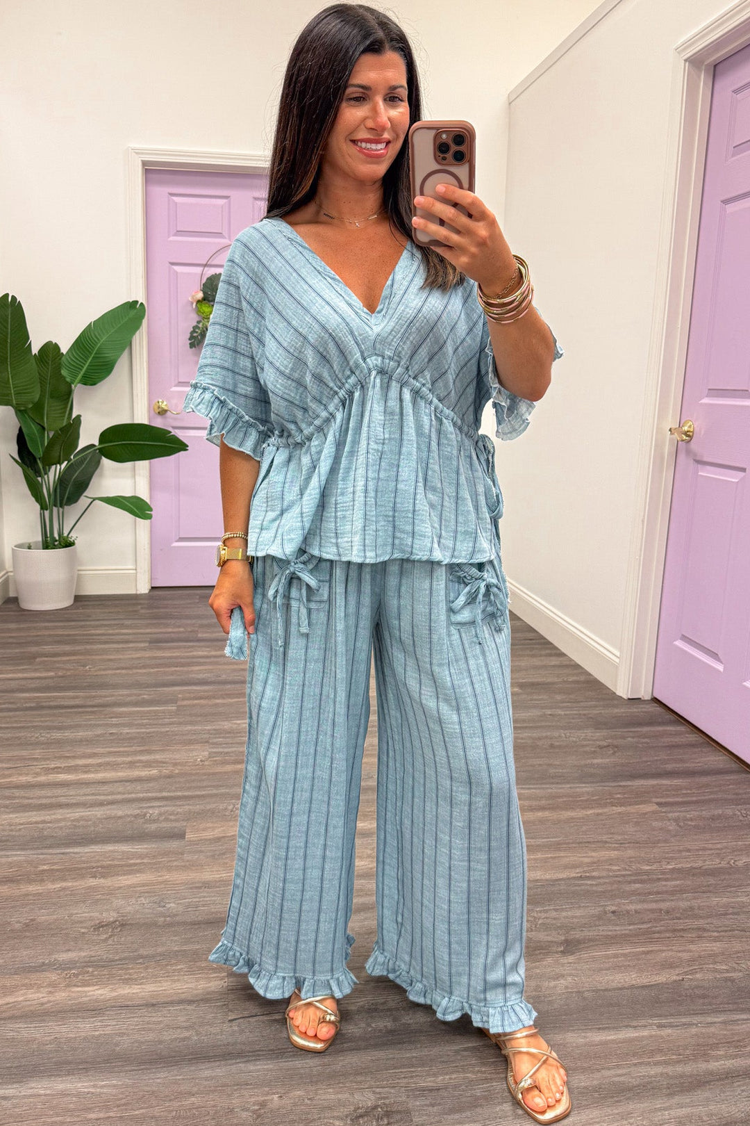 light blue with navy blue stripes drawstring cinch waist dolman sleeve deep v neckline top