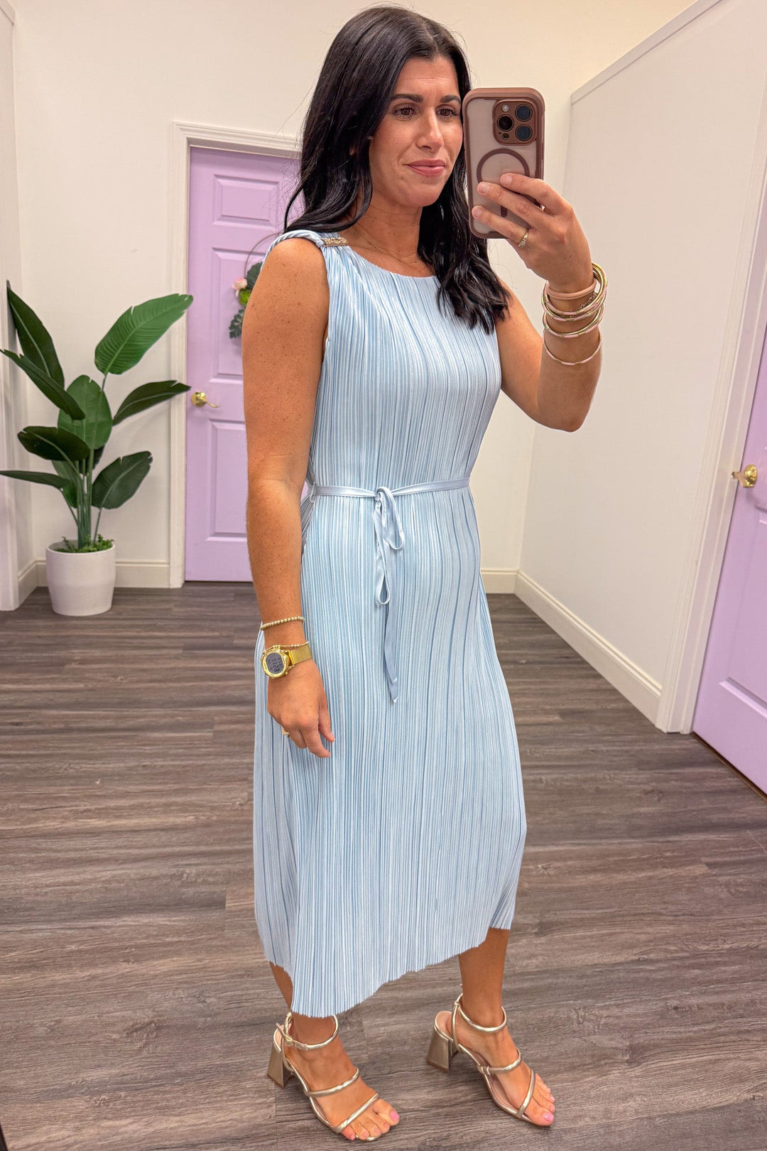 pastel blue pleated sleeveless satin midi dress with self tie waist belt