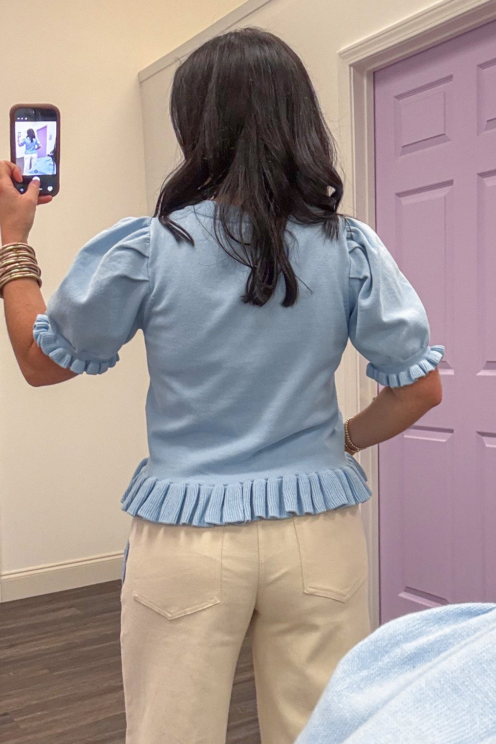Baby blue ruffle trim slightly cropped knit top back view