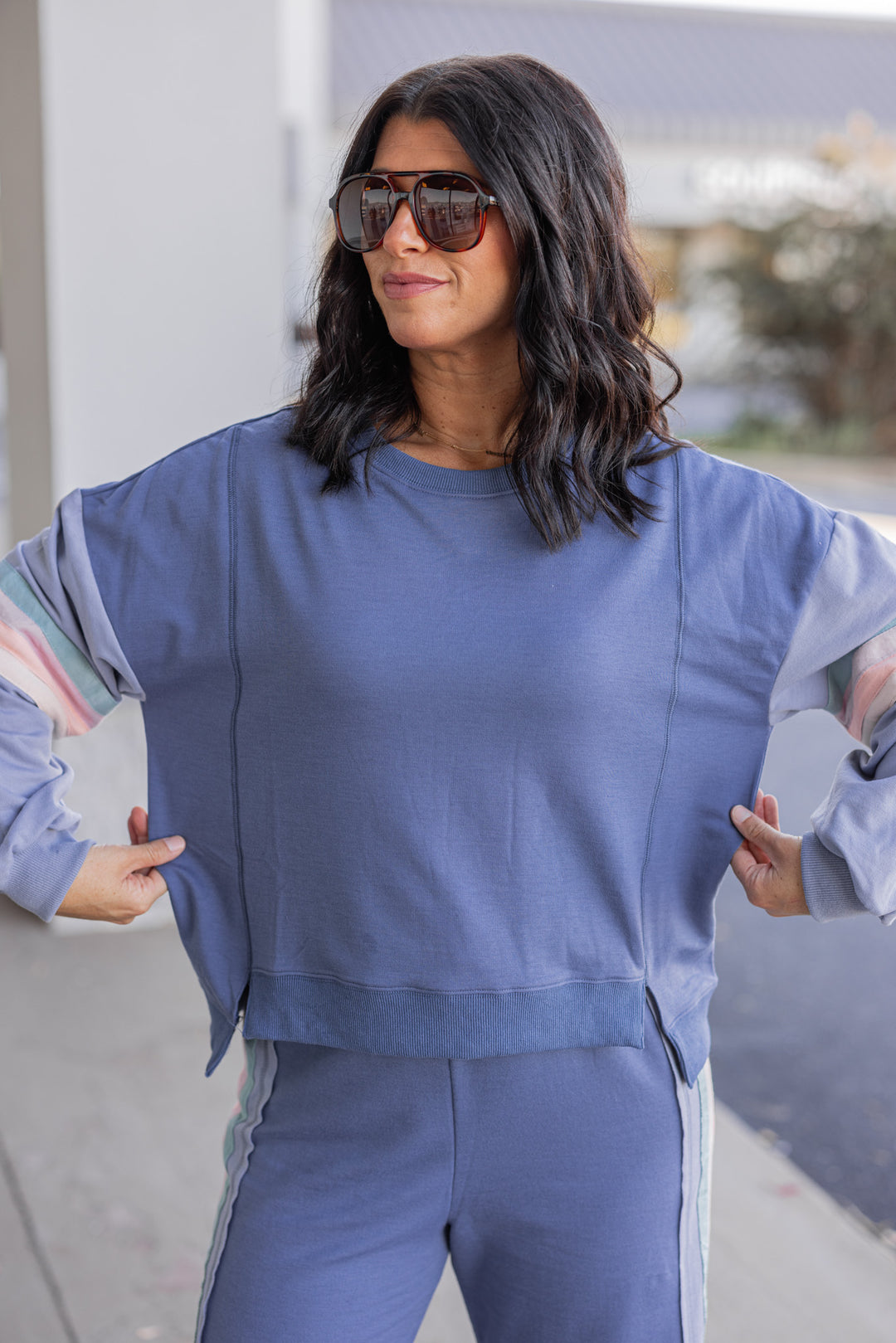 Women's knit top and matching pants set in blue denim shade with stripe trim details by Very J showing top's true to size fit