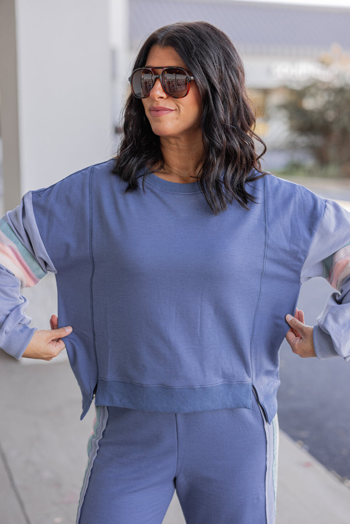Women's knit top and matching pants set in blue denim shade with stripe trim details by Very J showing top's true to size fit