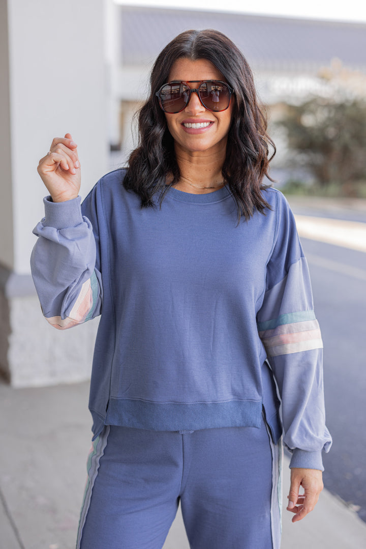 Women's knit top and matching pants set in blue denim shade with stripe trim details by Very J showing up close front view of top