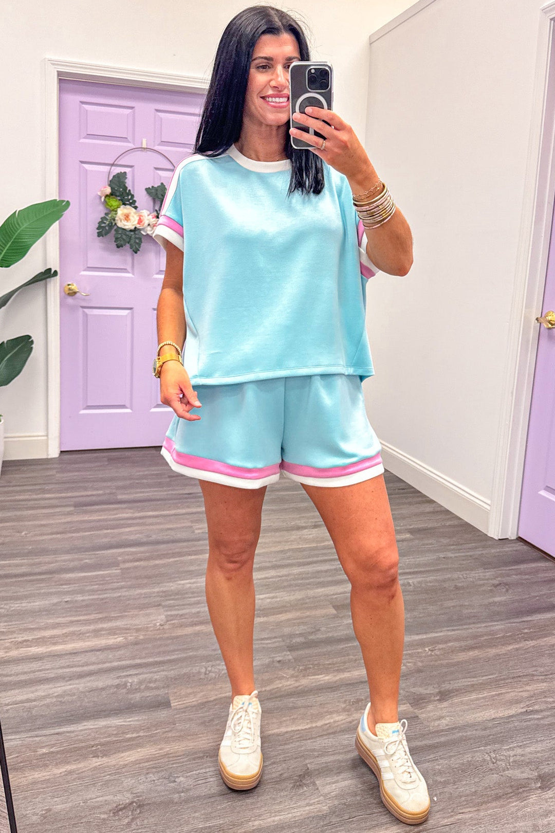 pink and white trimmed scuba knit light blue shorts