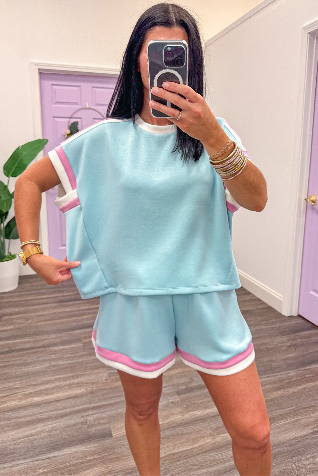 pink and white trimmed scuba knit blue top relaxed silhouette