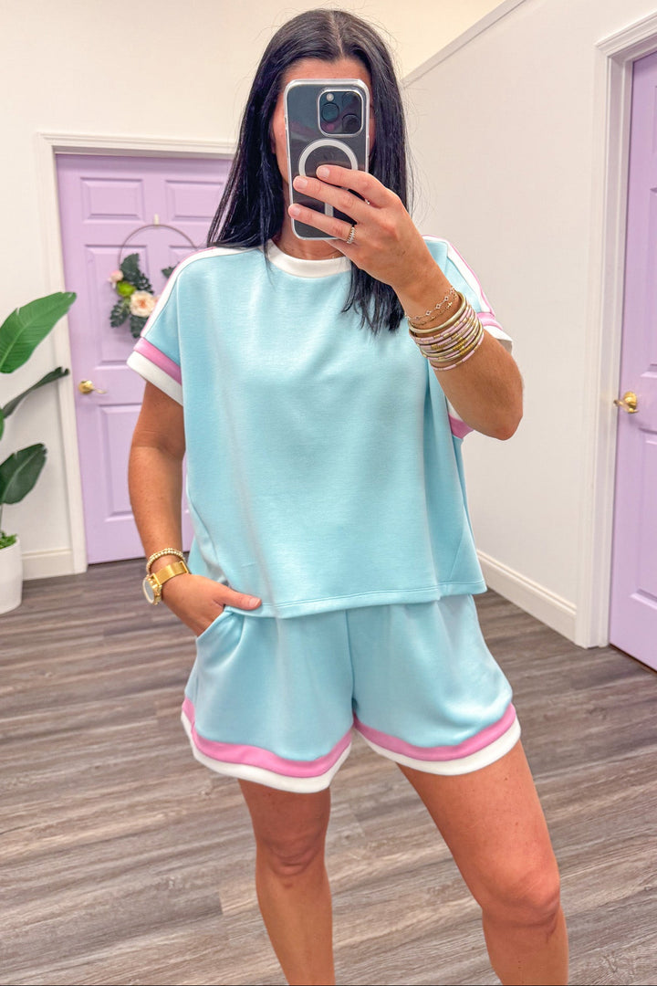 pink and white trimmed crew neckline scuba knit blue top