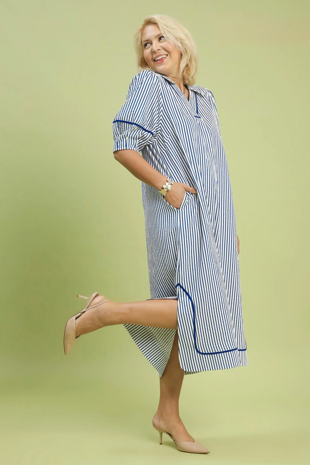 Women's Umgee blue and white striped maxi dress with navy trim in plus size showing full side view with slit 