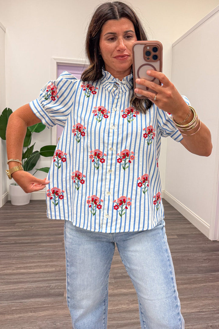 blue and white striped with red and pink embroidered flowers relaxed silhouette button front top