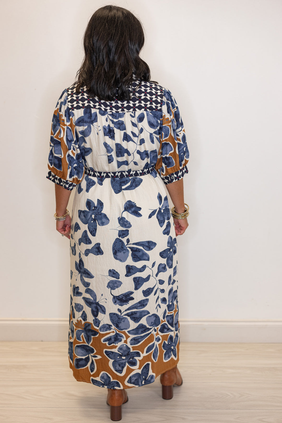 Women's cream, blue and caramel floral midi dress with navy and red floral trim by Entro showing full back view