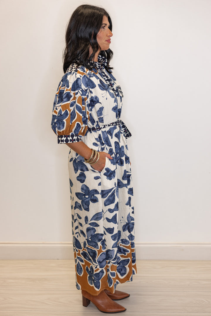 Women's cream, blue and caramel floral midi dress with navy and red floral trim by Entro showing full side view