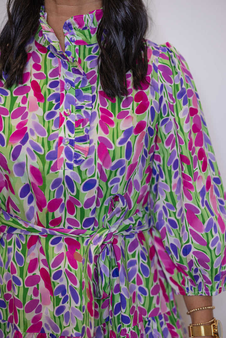 Women's green poplin dress with multicolor floral print by Jodifl showing belted waistband