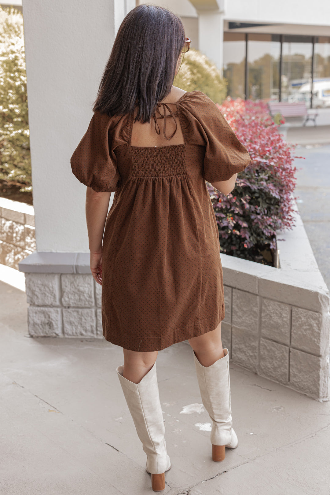 Women's brown pleated corduroy dress with black polkadots by Wishlist showing full back view