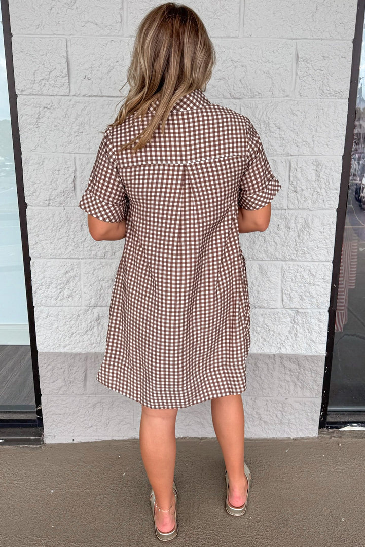 brown and cream gingham checkered print short sleeve button front bodice dress with chest and side pockets