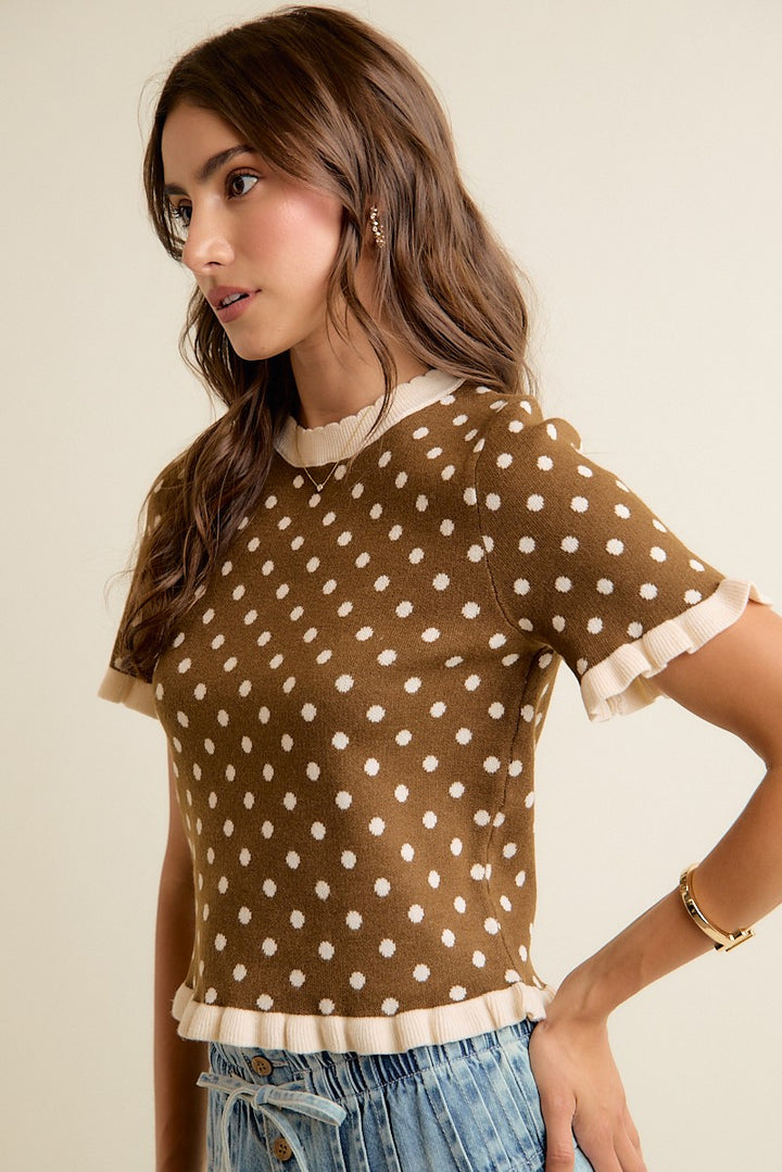 Brown and cream knit top with ruffle trim and a flattering silhouette