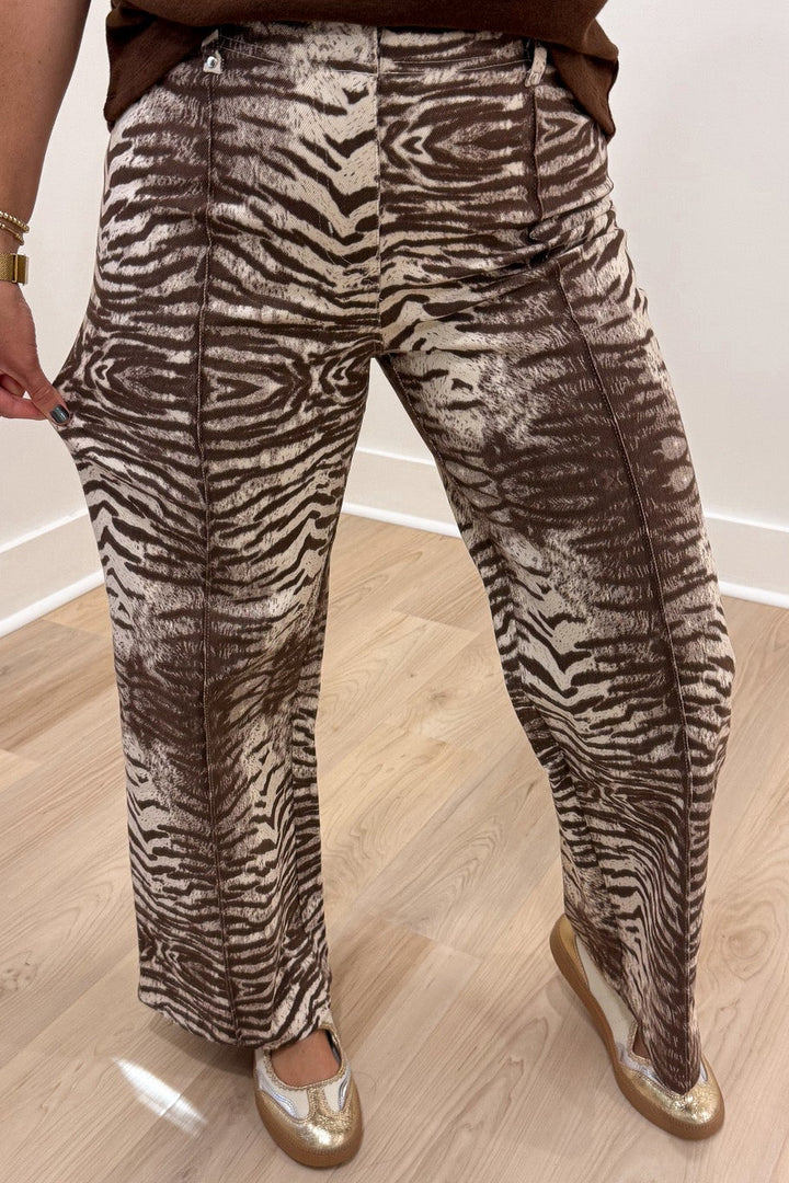 brown and cream zebra print wide leg twill denim pants with pintuck details and belt loops