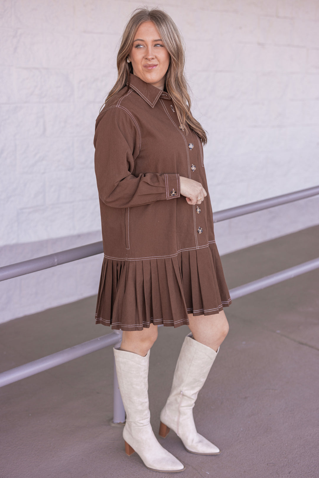 Women's brown denim twill button front dress with cream stitching trim by Entro  showing side view