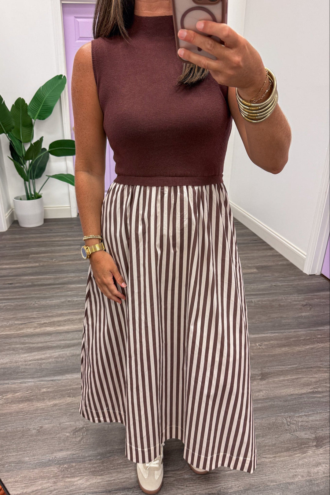 brown and ecru midi dress with sleeveless mock neck sweater top and striped woven skirt