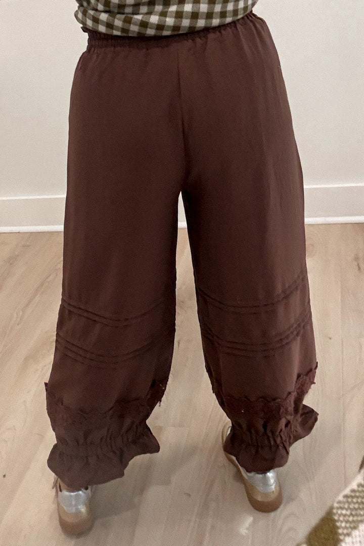 solid brown elastic waist wide leg cropped pants with elastic ruffle cuffed ankles and stitching details