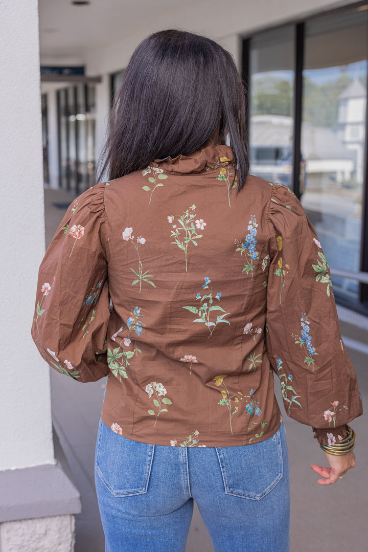 Women's brown multicolor floral print button front poplin top by Entro showing back view