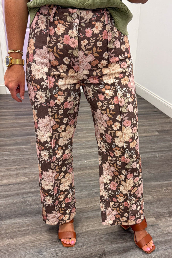 brown with multicolored floral print wide leg denim pants with pintuck details and button zipper closure
