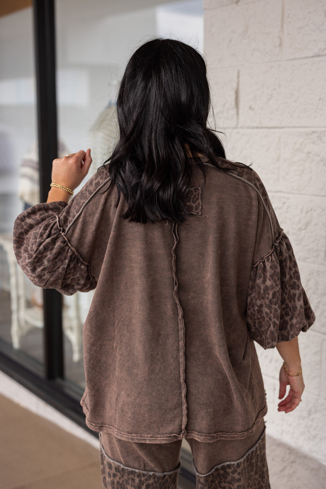Women's mineral washed oak brown knit top with animal print colorblock details by J Her showing up close back view