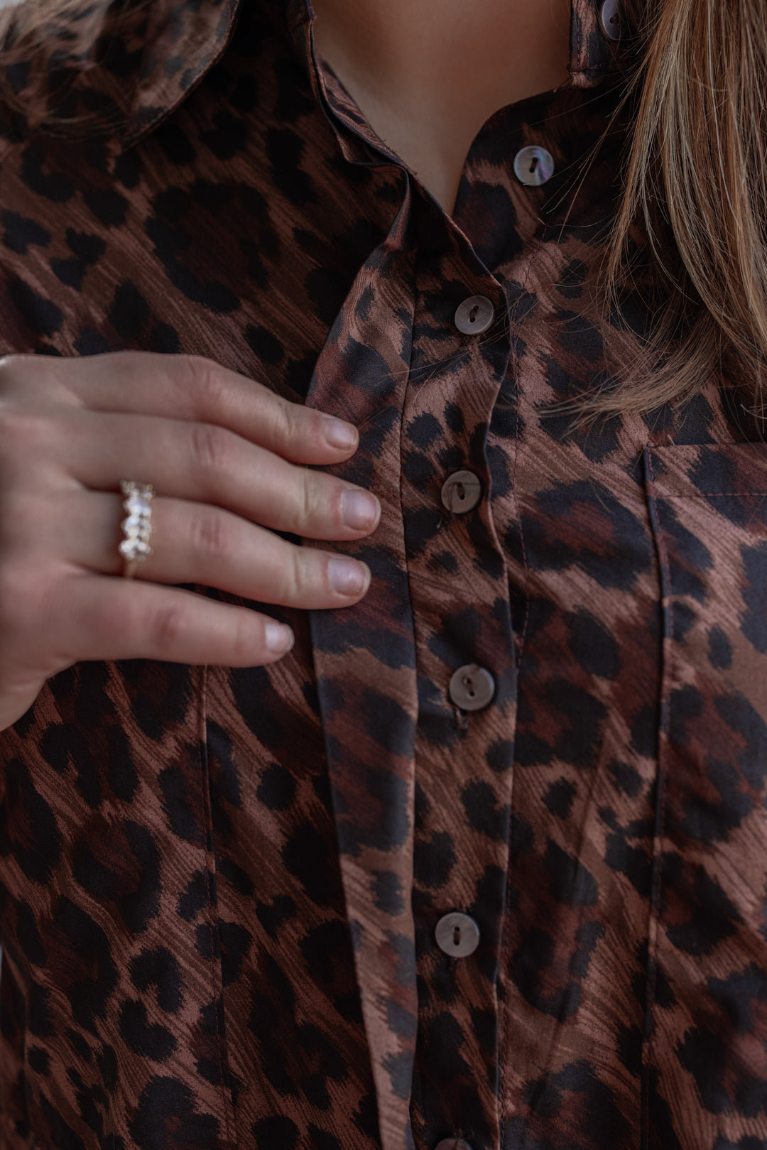 Women's brown and black leopard print Ana pocket dress by Karlie showing up close view of button front closures