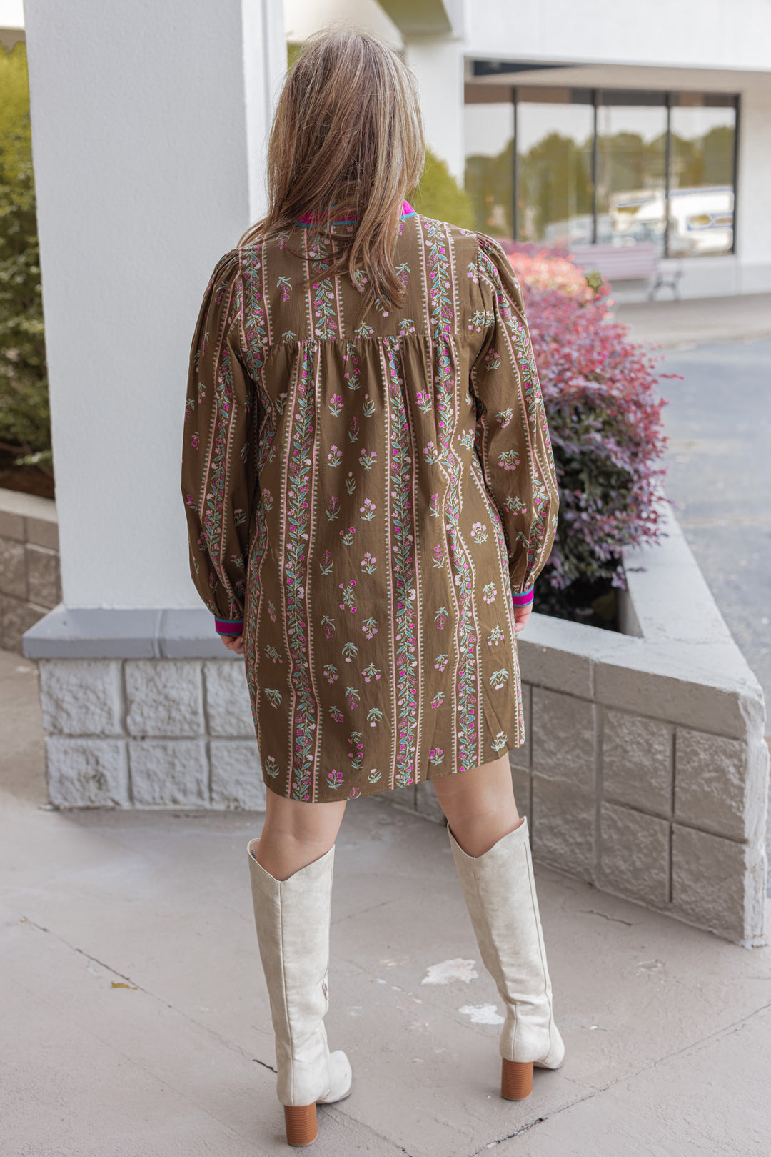 Women's brown olive babydoll dress with floral trellis print and hot pink trim by Jodifl showing full back view