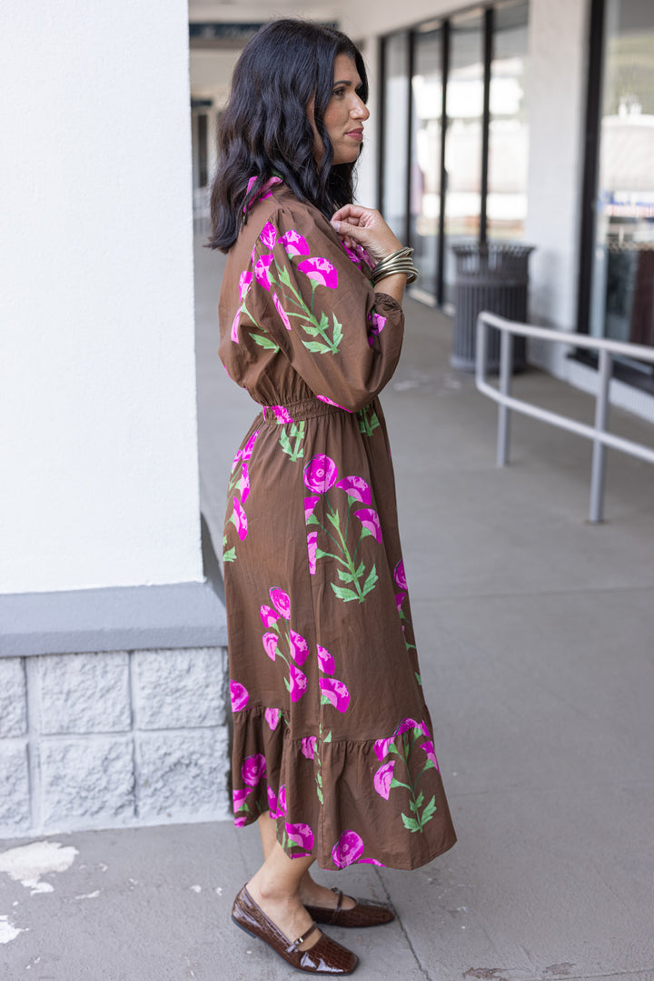 Women's brown midi dress with pink and green florals and pink ruffle trim by Umgee showing full side view