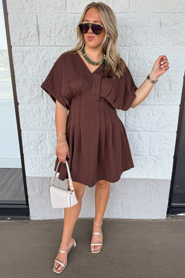 solid brown dolman sleeve v neckline short dress with pleated flowy skirt
