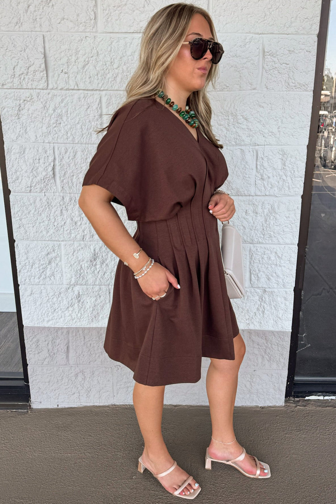 solid brown dolman sleeve v neckline pleated short dress with pintuck details and side pockets
