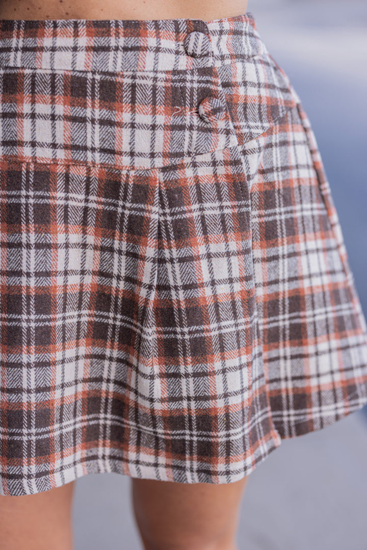Women's brown, taupe and orange plaid flannel skirt lined with shorts by Jodifl showing up close view of plaid print