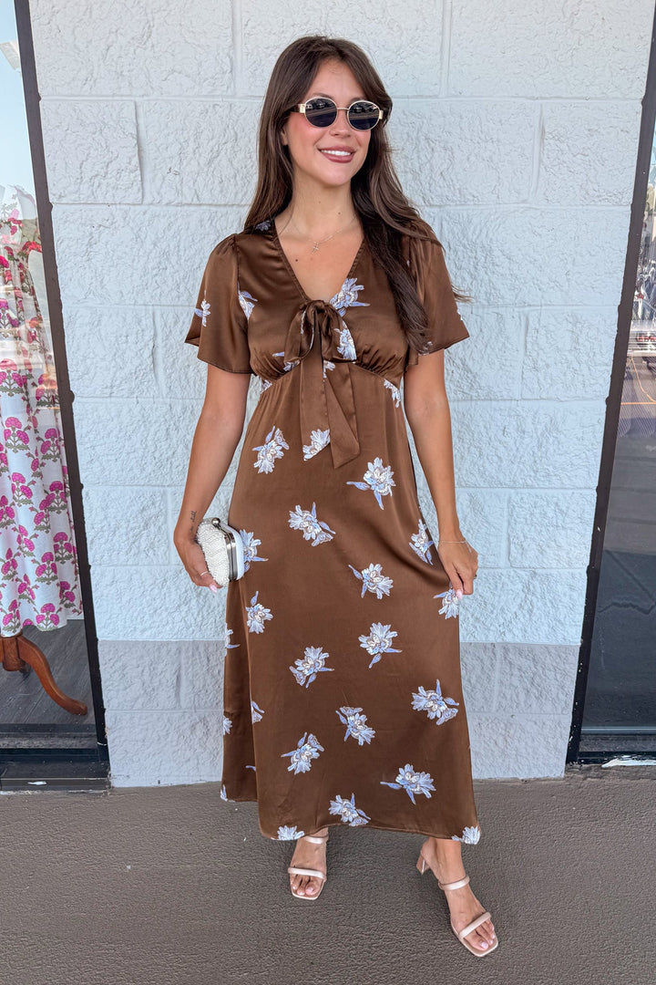 brown satin midi dress with sky blue floral print and tie chest detail