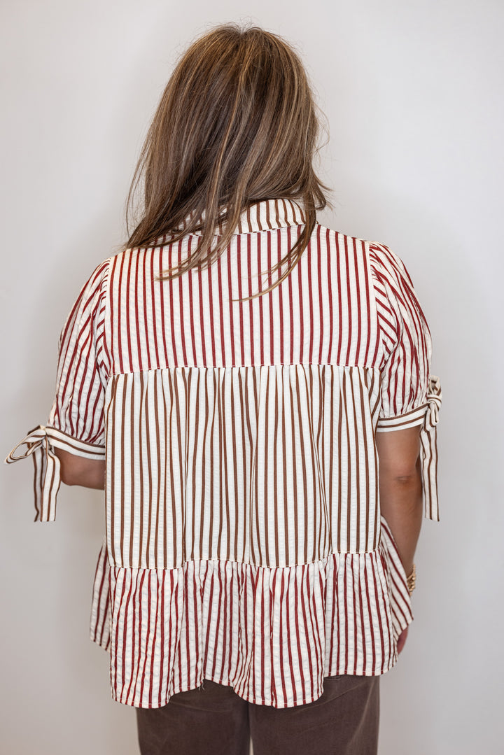 Women's cream tiered babydoll top with burgundy and brown colorblock stripes by Fantastic Fawn showing up close back view