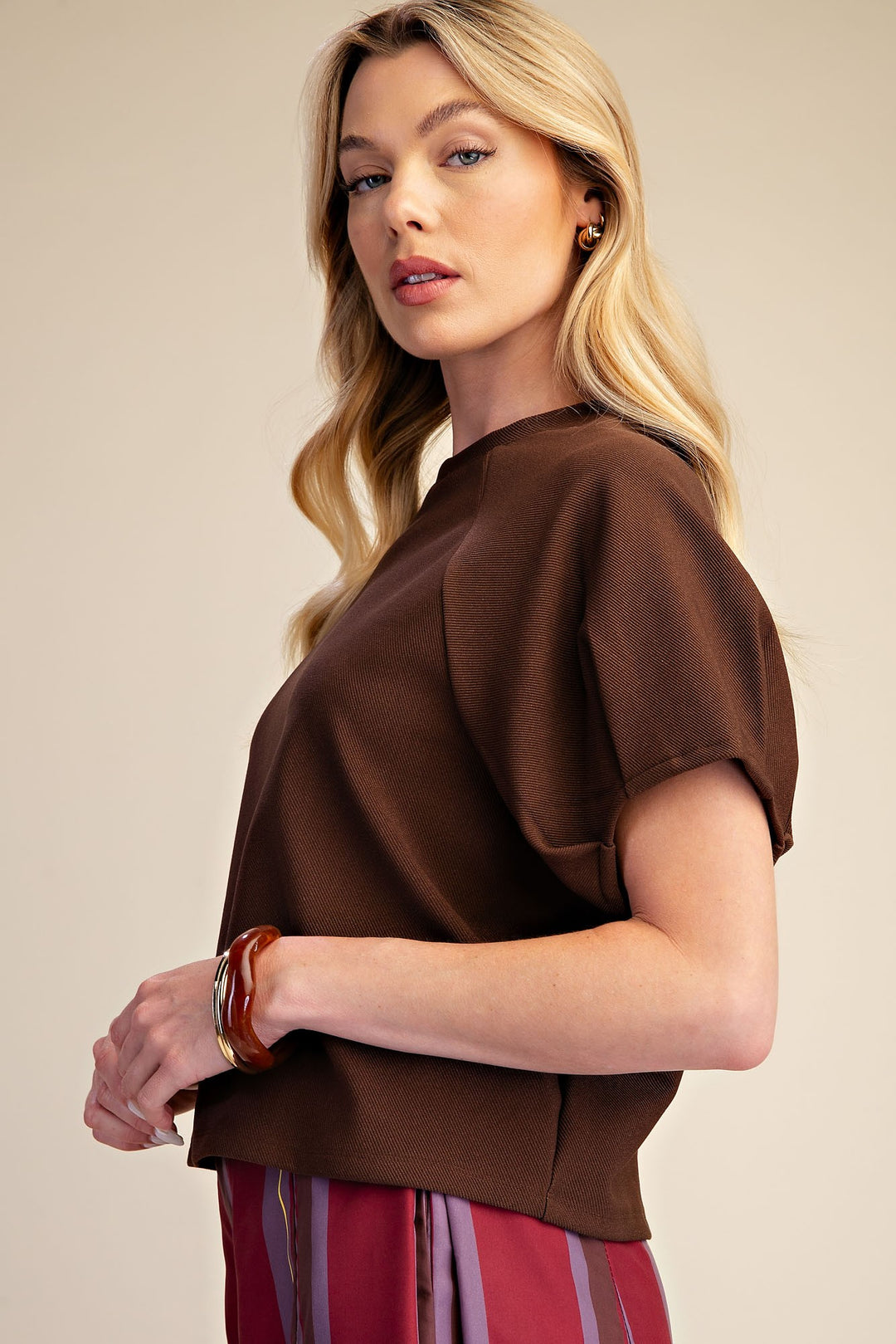 Brown ribbed knit top with gathered puff sleeves