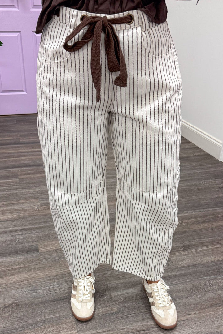 brown and off white striped wide barrel leg denim pants with functional decorative drawstring