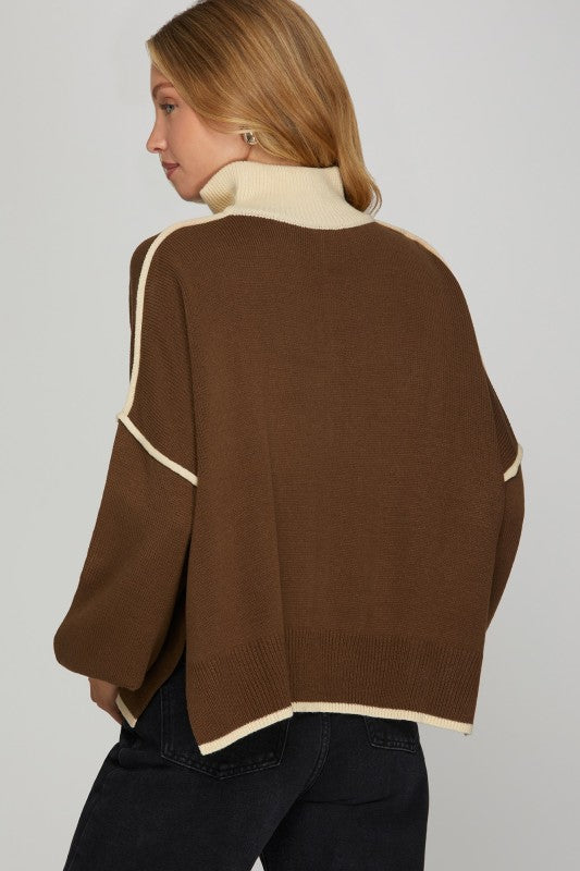 Women's brown knit sweater with cream trim and a zipper bodice by She+Sky showing back view