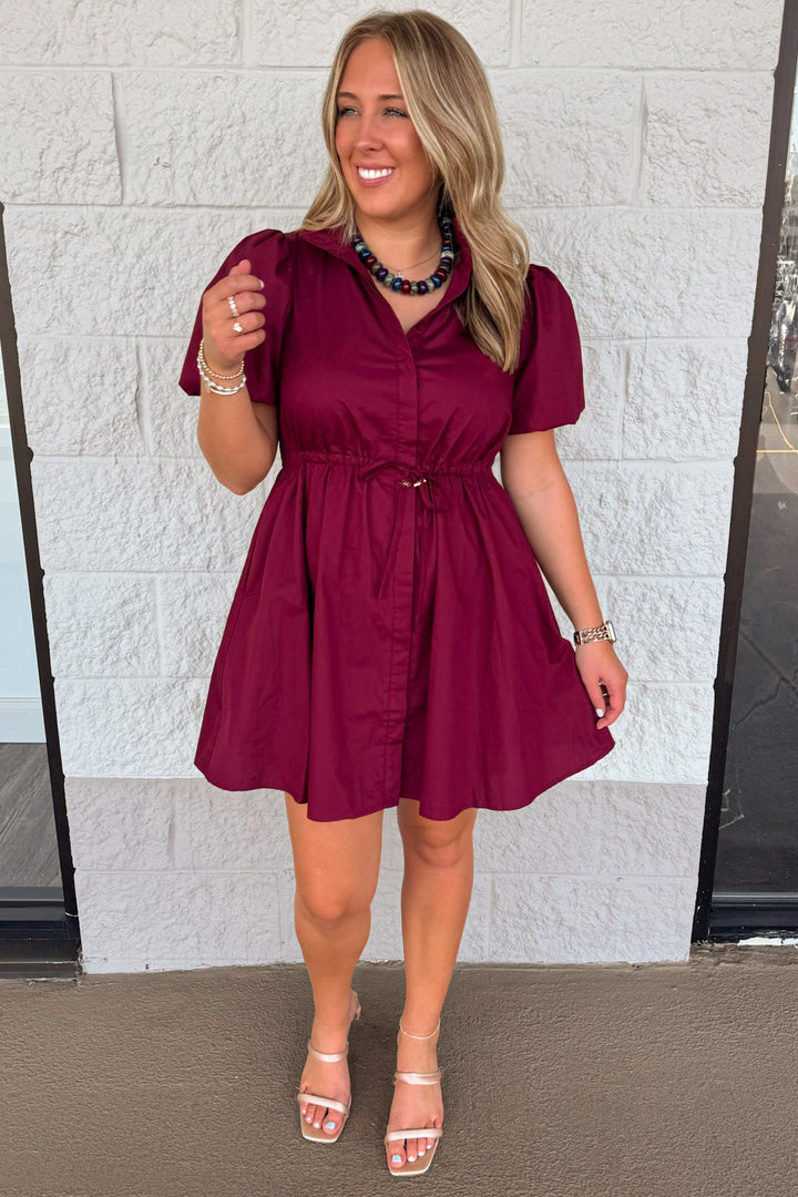 solid burgundy button front mock neck puff sleeve cinch waist cotton poplin short dress