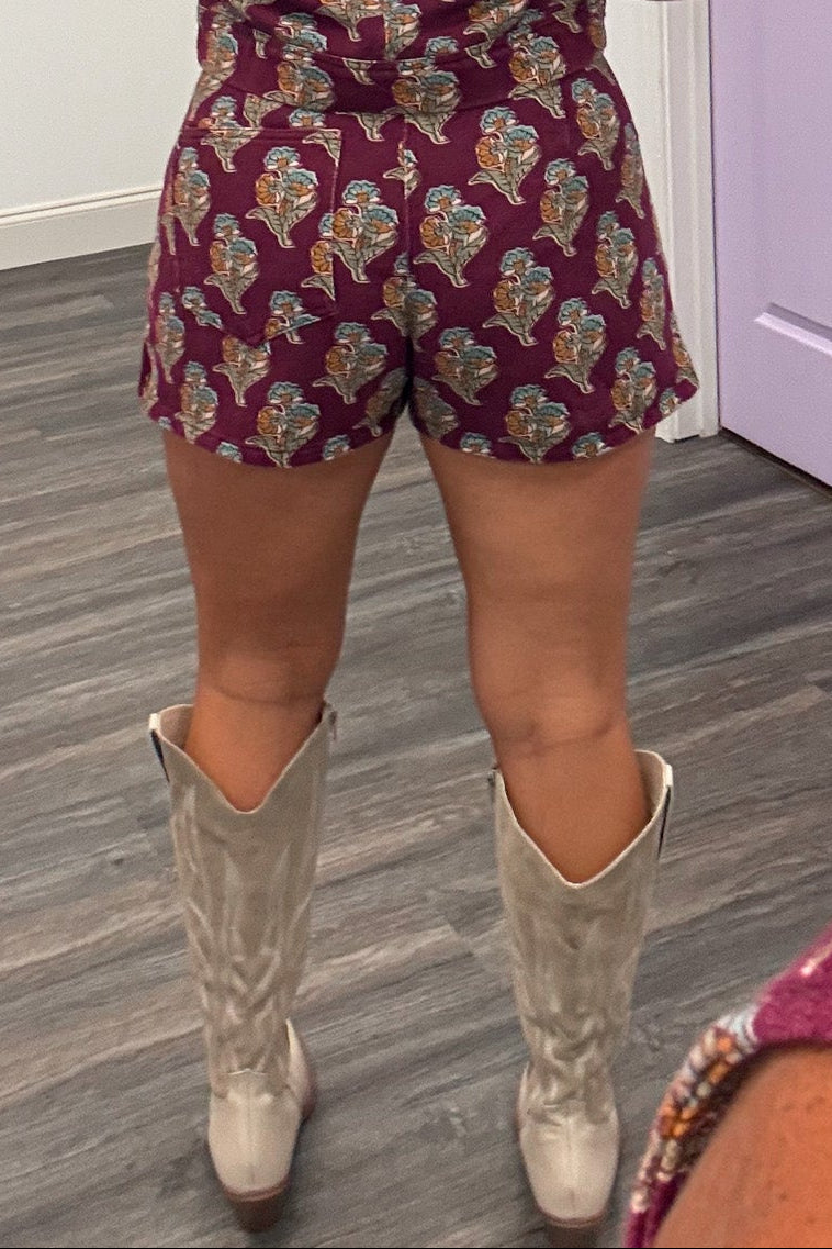 burgundy with orange teal and olive floral print denim mini skort with one back pocket