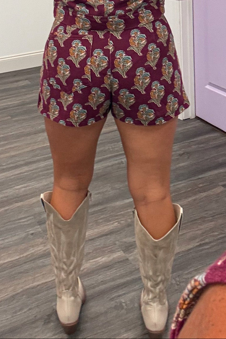 burgundy with orange teal and olive floral print denim mini skort with one back pocket