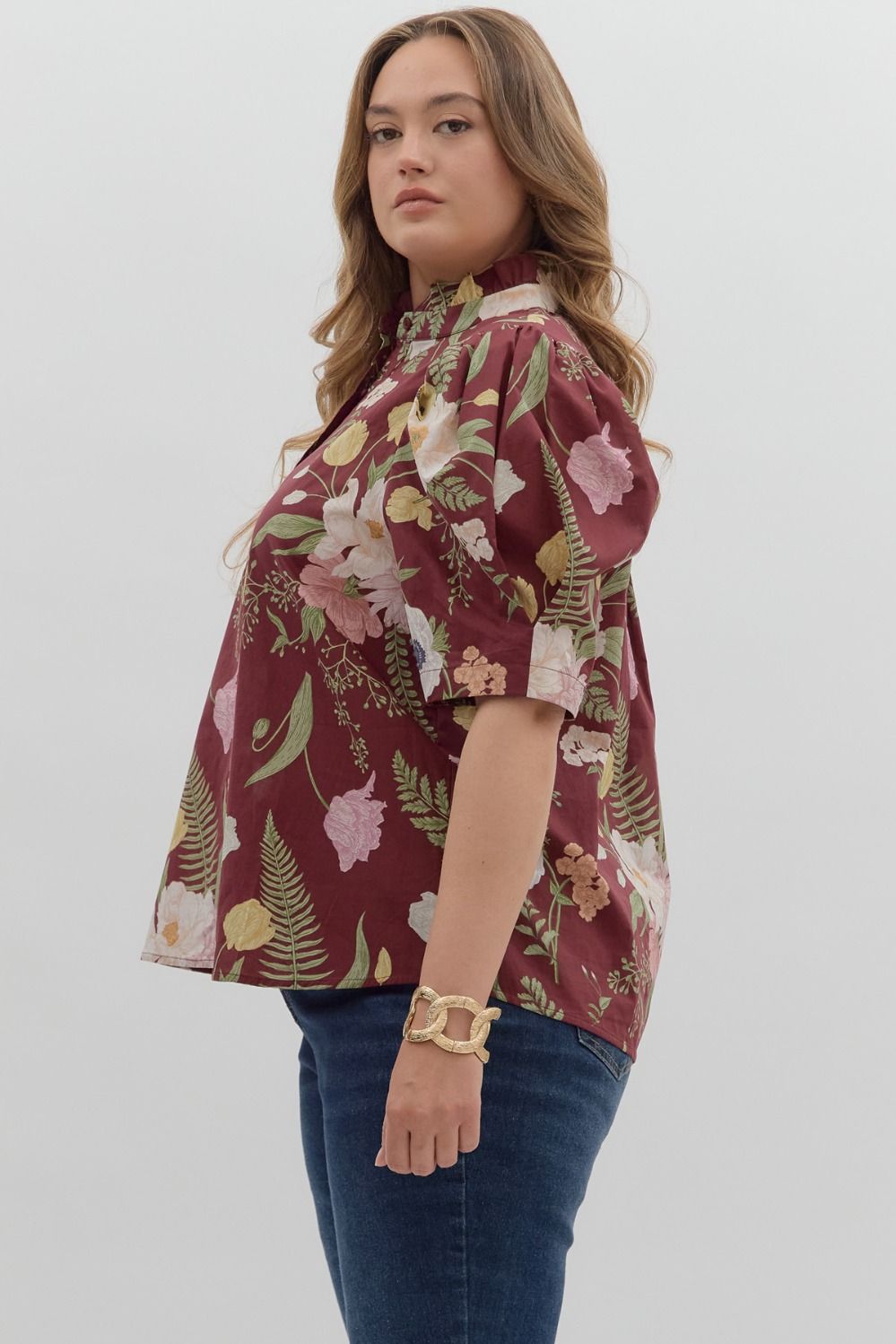 Women's burgundy floral print button front top by Entro, showing side view