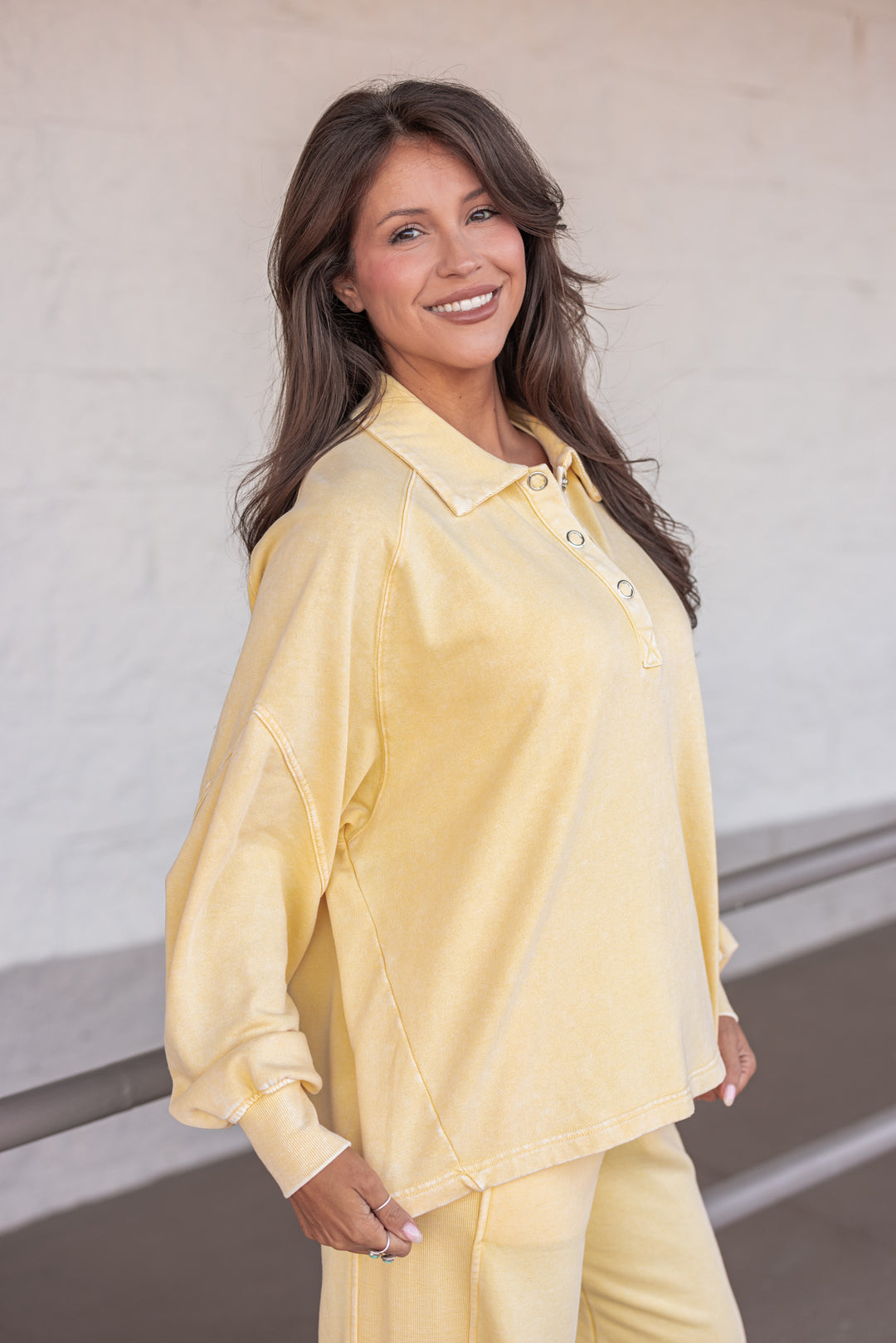 butter yellow button neckline pullover top side view