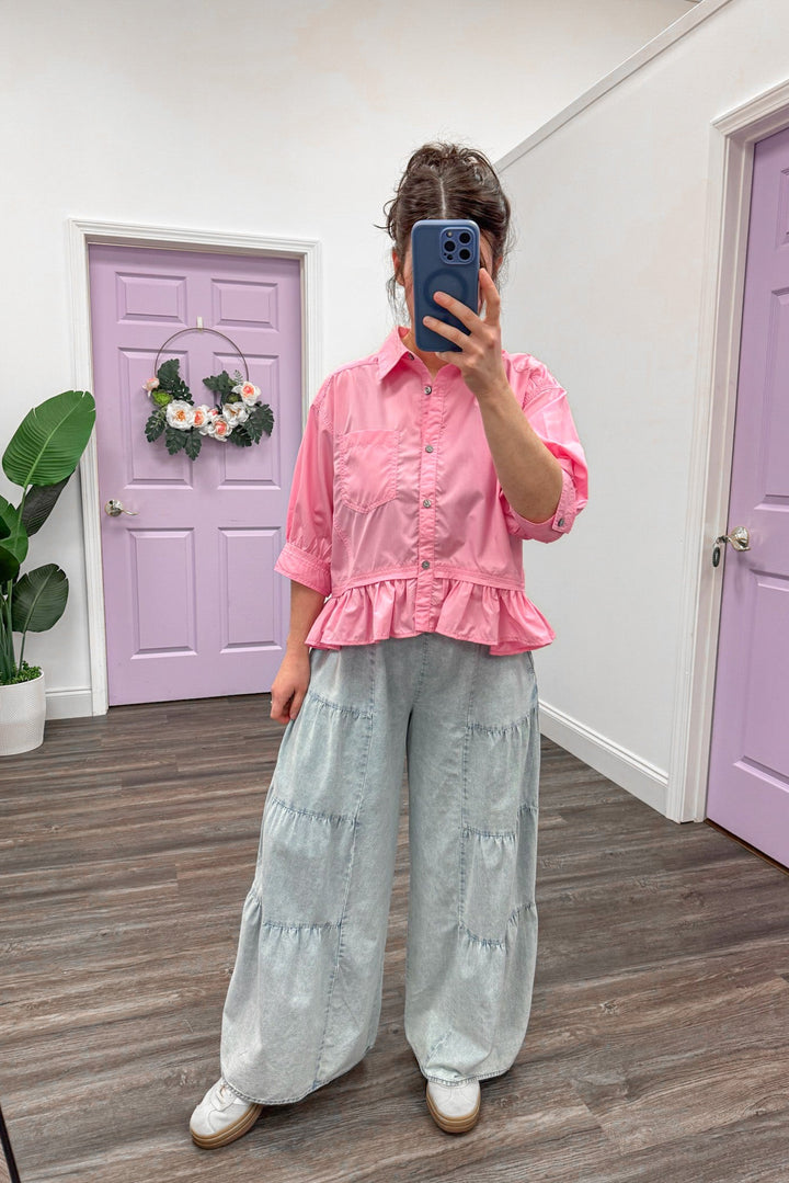 Women's semi-cropped button down pink peplum top with ruffled hem by Entro