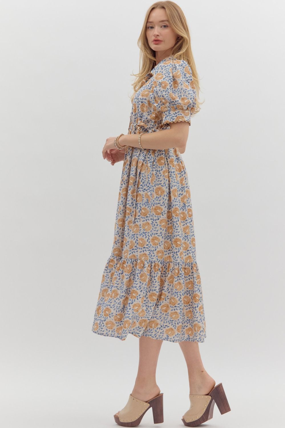 Women's cream button front midi dress with caramel and blue floral print by Entro showing full side view
